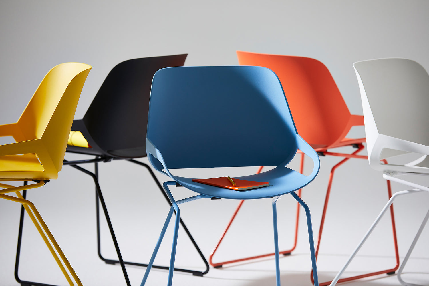 Aeris Numo design chair with skid base in bright colors